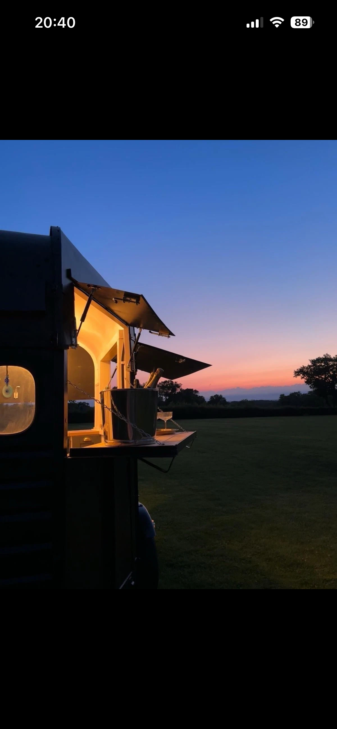 Warmly lit, elegant bar ready for an evening event